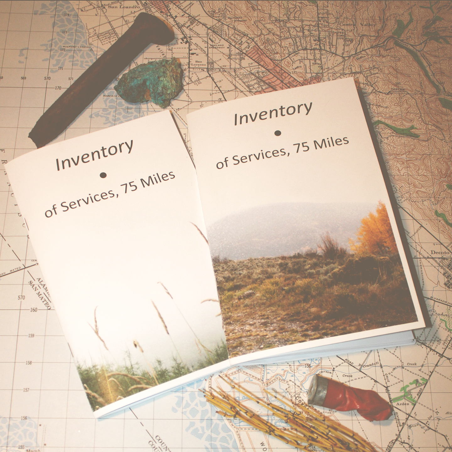 Two small books lying on a map.