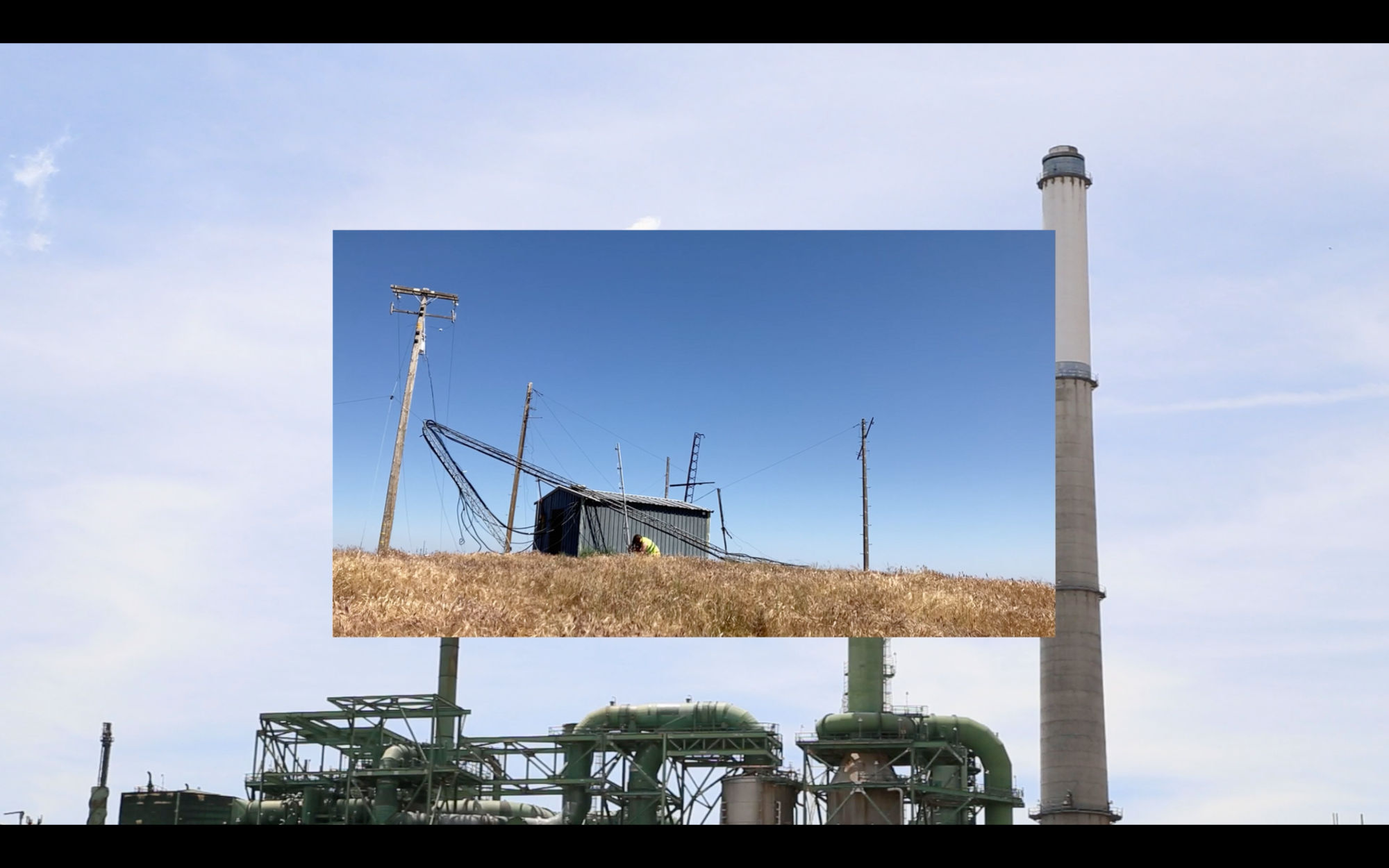 an image of a person holding a radio antenna near some radio towers, superimposed over an image of an industrial chemical processing facility.